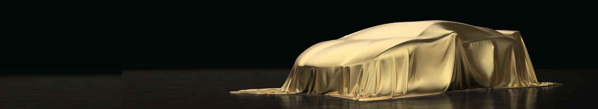 samochód nakryty złotym materiałem